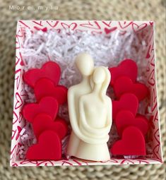 a red and white box filled with lots of hearts