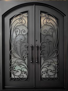 an ornate iron door with glass panels on the front and side doors are shown in black