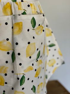 an apron with lemons and dots on it