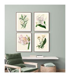 three framed floral prints on a wall above a green chair and white table with a wicker basket