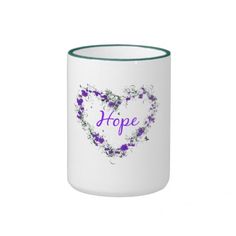 a white mug with purple flowers and the word hope on it