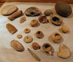 several different types of rocks and tools on a table