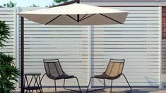 two chairs and an umbrella on a patio