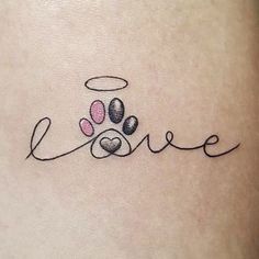 the word love is written in cursive writing with two paw prints on it