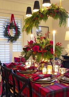 a dining room table set for christmas dinner