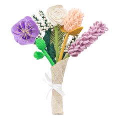 a vase filled with flowers on top of a white table