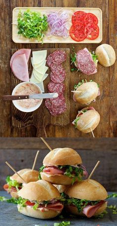 sandwiches with meat, lettuce and tomatoes on them are ready to be eaten