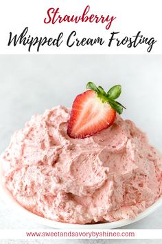 strawberry whipped cream frosting in a white bowl with strawberries on top and text overlay