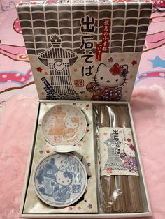 hello kitty plates and napkins in a box