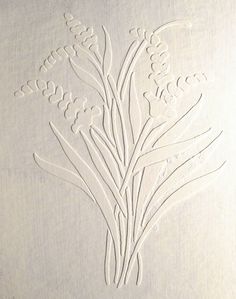 a white piece of paper that has some flowers on it with lines drawn in the middle