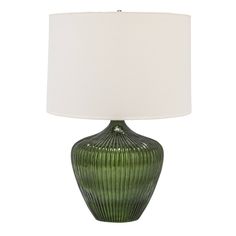 a green table lamp with a white shade