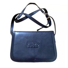 1980s Kenzo Navy Blue Leather Clutch Crossbody Bag  flap top, adjustable strap, Kenzo logo printed on front, inside compartments, in very good vintage condition  20x18x5cm - strap 80cm long Kenzo Crossbody Bag, Kenzo Logo, Leather Clutch, Blue Leather, Purses And Handbags, Crossbody Bag, Adjustable Straps, Navy Blue, Shoulder Bag