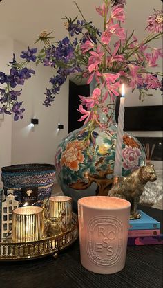 a candle and some flowers on a table