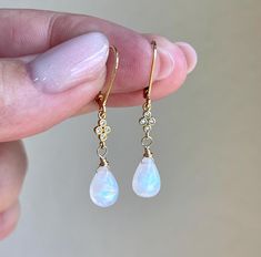 Rainbow Moonstone Earrings, Teardrop Dangle Earrings, Minimalist Gold Earrings, June Birthstone, Small Moonstone Earrings, Gift for women These precious delicate earrings feature blue flash rainbow moonstone smooth teardrops adorned with a white topaz connector in either gold or silver finish. The earrings are suspended from lever back ear wires in gold filled or sterling silver. These earrings are very feminine and subtle, perfect for every day and the moonstone makes them suitable for almost a Minimalist Gold Earrings, Bridal Party Jewelry, Minimalist Earrings Gold, Silver Gift Wrap, Freshwater Pearl Jewelry, Earrings Teardrop, Teardrop Dangle Earrings, Moonstone Earrings, Jewelry Lookbook