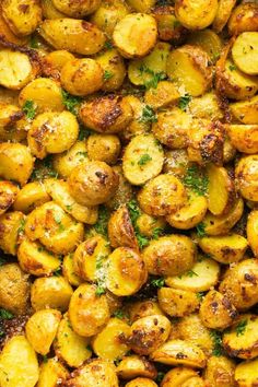 roasted potatoes with parsley on top in a casserole dish, ready to be eaten