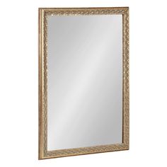 a gold framed mirror on a white wall