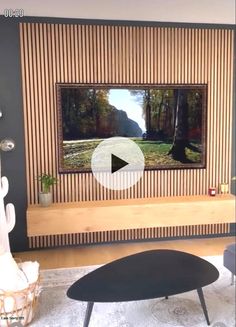 a flat screen tv mounted to the side of a wooden wall in a living room