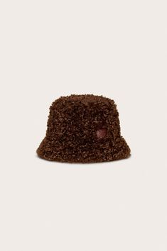 A fur trimmed patent leather reversible bucket hat. — Patent leather — Fur lined — Reversible Comfy Gifts, Cozy Essentials, Reversible Bucket Hat, Swimming Bag, Man Hat, Style Aesthetic, Candle Collection, Kids Sandals, Home Candles