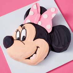 a minnie mouse cake on a white plate