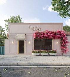 a pink building with purple flowers on the front and side windows that say ama clara