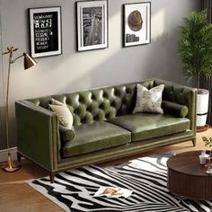 a living room with zebra rugs and green couches in the middle of it