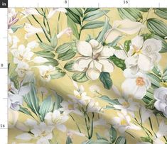 a white flower and green leaves pattern on a light colored background with measurements for the fabric