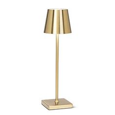 a gold floor lamp on a white background with a light shade in the corner and a square base