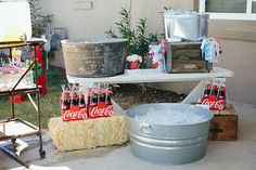 an outdoor party with coca - cola and hay bales