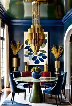 an elegant dining room with blue walls, gold chandelier and art work on the wall