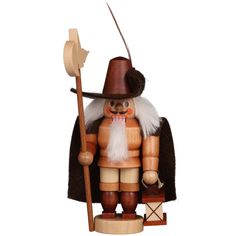 a wooden nutcracker with a hat and cane