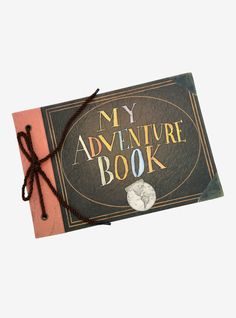 an adventure book is tied up to a card with the words, my adventure book on it