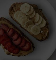 two pieces of toast with peanut butter and sliced bananas