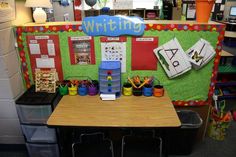 a classroom desk with writing supplies on it