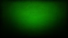 a dark green background with some light on it