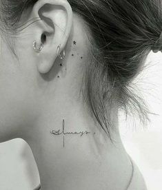 a woman's neck with the word love written on her left side behind her ear