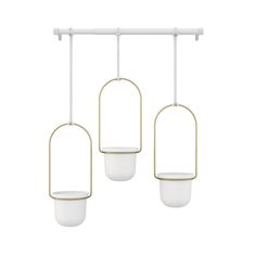 three hanging lights with white and gold accents