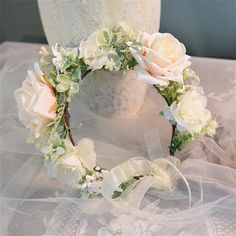 Our Forest-Inspired Floral Wreath is a cascade of layered flowers that exudes elegance with its natural draping texture and delicate, unique colors. The vibrant hues bring out the lively and spirited beauty of the arrangement, making it a captivating addition to any setting. Primrue Wreath Color: Champagne | Primrue Forest-Inspired Floral Wreath in Champagne | 1" H X 19.69" W X 19.69" D | Wayfair Flower Crowns Wedding, Fairy Flower Crown, Crown For Bride, Bride Wedding Hair, Flower Crown Wedding, Color Champagne, Flower Crowns, Bride Wedding, Wedding Hair Accessories