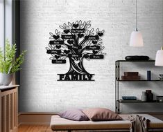 the family tree wall decal is mounted on a white brick wall