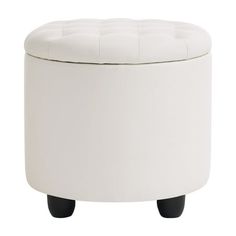 a white stool with black legs and a buttoned lid on it's side