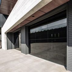 an empty parking lot with two garage doors