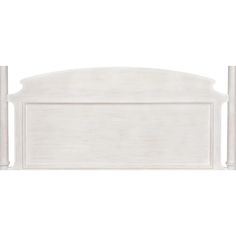 a white headboard with two posts on it