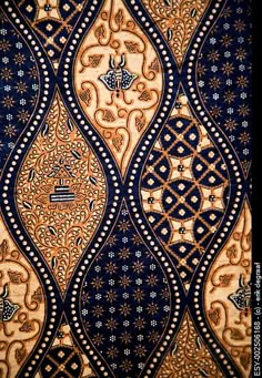 an intricately designed wallpaper with blue and gold colors