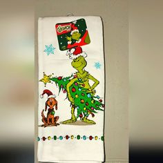 the grinch towel is hanging on the wall