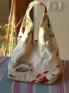 a purse sitting on top of a table next to a window sill and door