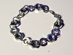 Handmade upcycled nut and washer large bracelet measuring 9 inches. Large Bracelet, Nuts And Washers, Washer, Chain Link Bracelet, Handmade Bracelets, Bead Work, Jewelry Bracelets, Chain, Purple