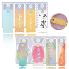 an assortment of different colored items in plastic cases with tags and magnets on them