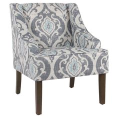 a blue and white chair with an ornate pattern on it