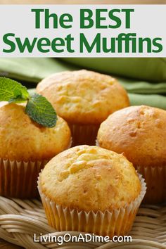 three muffins sitting on top of a wicker basket next to a green napkin