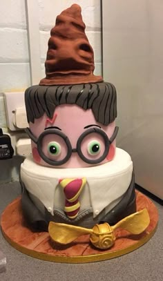 a cake with a man's face and glasses on it