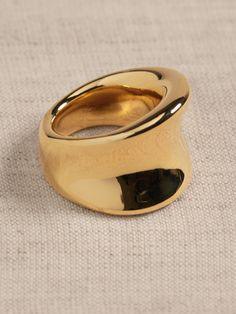 Our gleaming golden ring is formed with a highly reflective polished channel.  Timeless Classics: Luxury, everyday.  A showcase of time-honored craftsmanship and skilled Italian artisans, these are the pieces you'll reach for season after season, delighting in their exceptional versatility and endless appeal.  12K-gold plated or silver-plated bronze.  Made in Italy.  Length: 0. 7" Timeless Black Luxury Suits, Luxury Timeless Black Suits, Luxury Gold Suits, Large Gold Band Ring, Modern Luxury Accessories, Modern Band Rings, Thick Ring Gold, Gold And Steel Ring, Faux Gold Rings